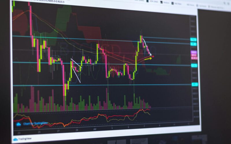 Close-up of a computer screen displaying cryptocurrency market trends and trading data.