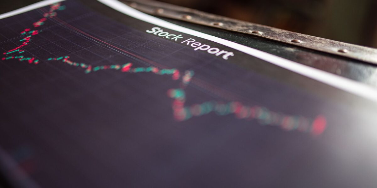 Detailed stock report showing market trends on paper charts.