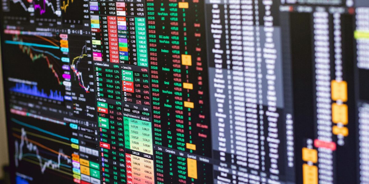 Detailed financial trading screen with colorful charts and data representing market fluctuations.