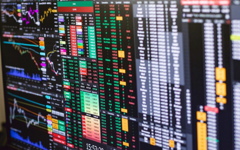 Detailed financial trading screen with colorful charts and data representing market fluctuations.