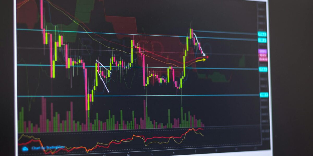 Close-up of a computer screen displaying cryptocurrency market trends and trading data.