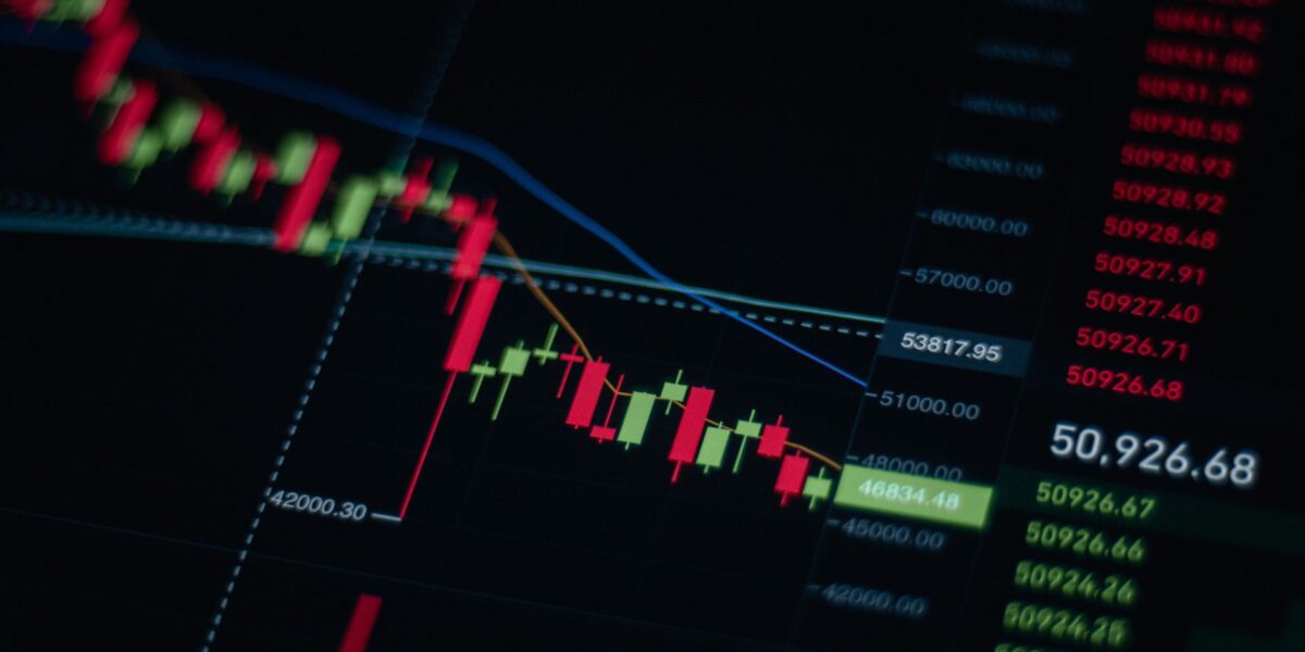 Close-up of stock market chart showing trends and data on a digital screen.