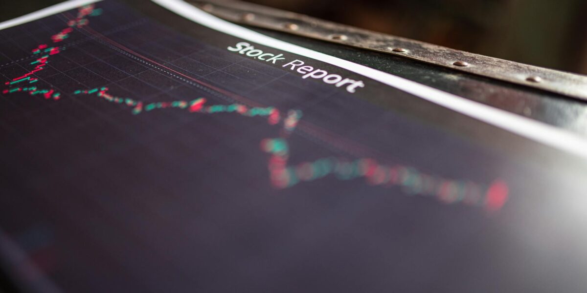 Detailed stock report showing market trends on paper charts.