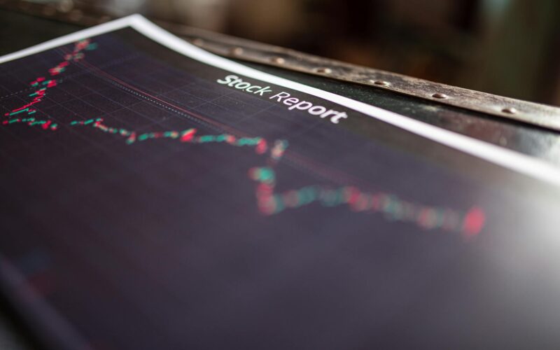 Detailed stock report showing market trends on paper charts.