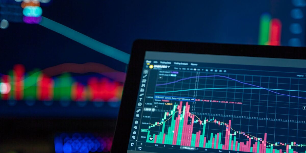 Colorful trading charts showing cryptocurrency market trends on a computer screen.