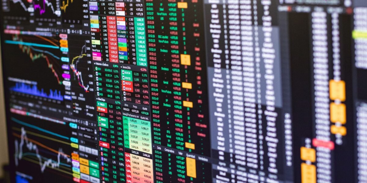 Detailed financial trading screen with colorful charts and data representing market fluctuations.