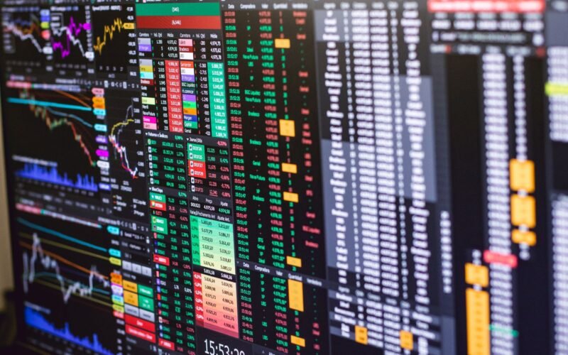 Detailed financial trading screen with colorful charts and data representing market fluctuations.