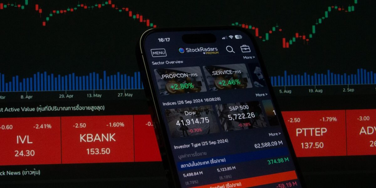 Close-up of a digital stock trading app interface with investment charts and market trends displayed.
