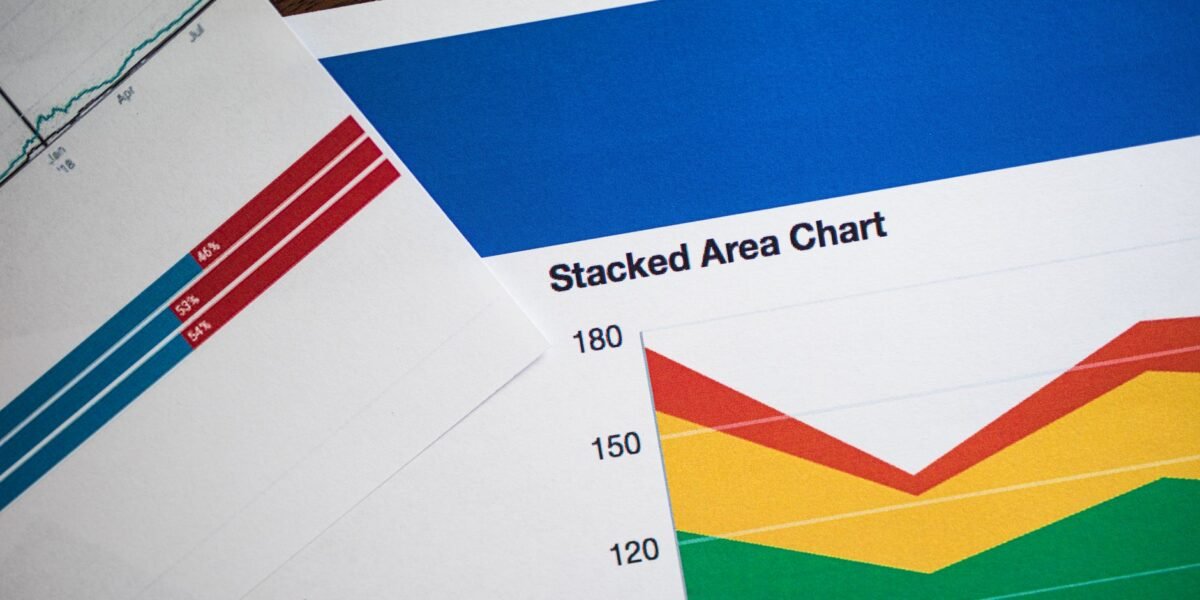 Vivid stacked area chart and graphs on paper, showcasing data analysis.