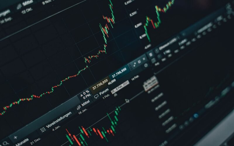 Close-up of stock market trading screen displaying financial growth and charts.