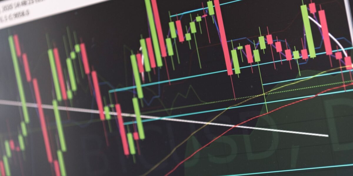 Close-up of vibrant stock market graphs displaying trading trends on a monitor, ideal for finance and cryptocurrency concepts.