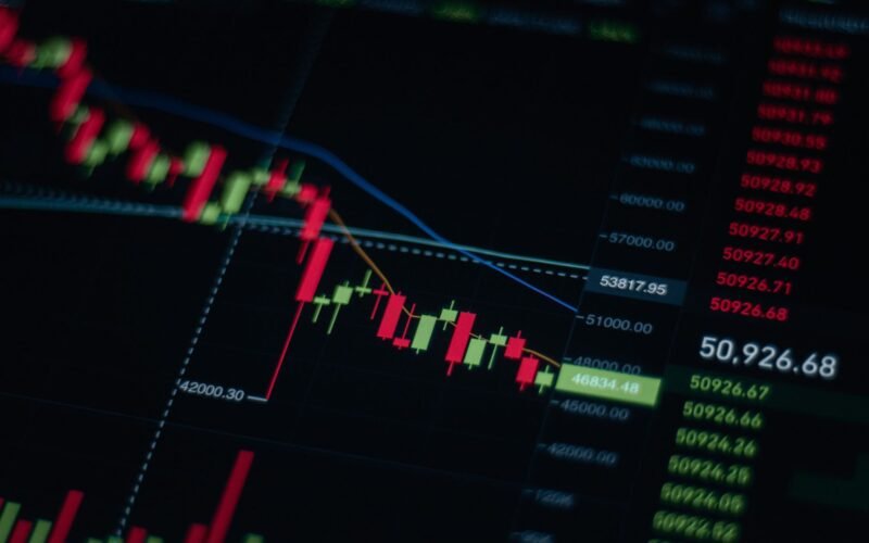 Close-up of stock market chart showing trends and data on a digital screen.