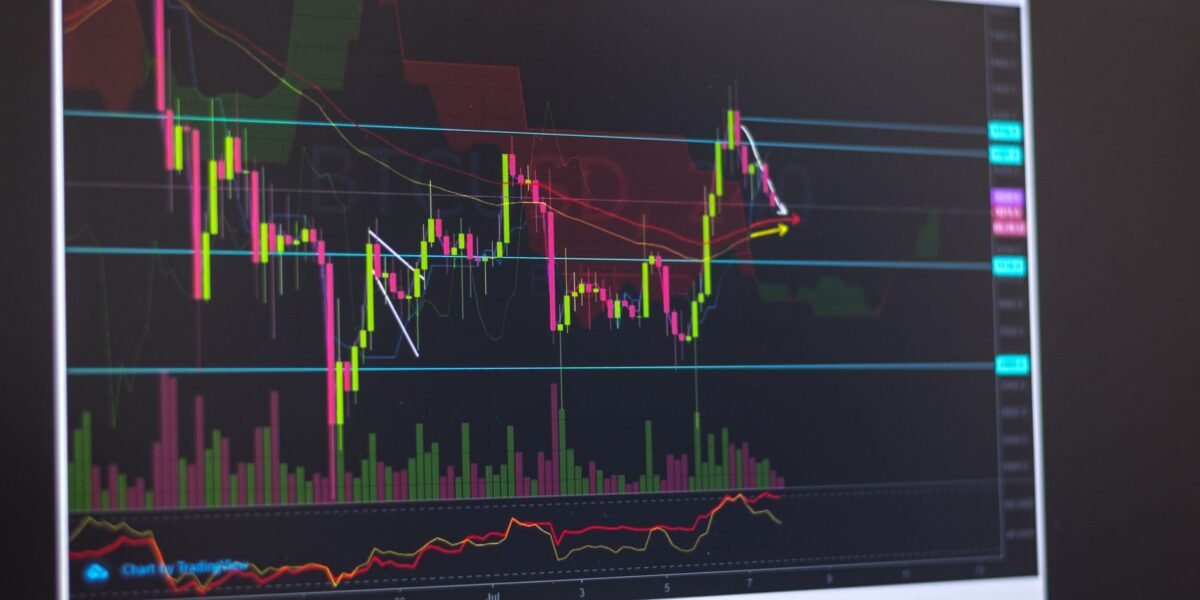Close-up of a computer screen displaying cryptocurrency market trends and trading data.