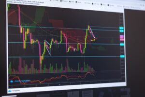 Close-up of a computer screen displaying cryptocurrency market trends and trading data.