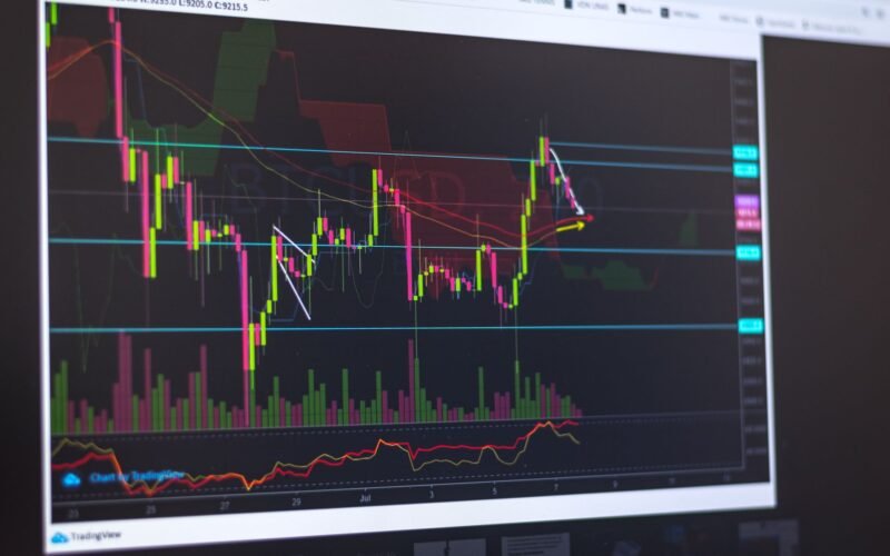 Close-up of a computer screen displaying cryptocurrency market trends and trading data.