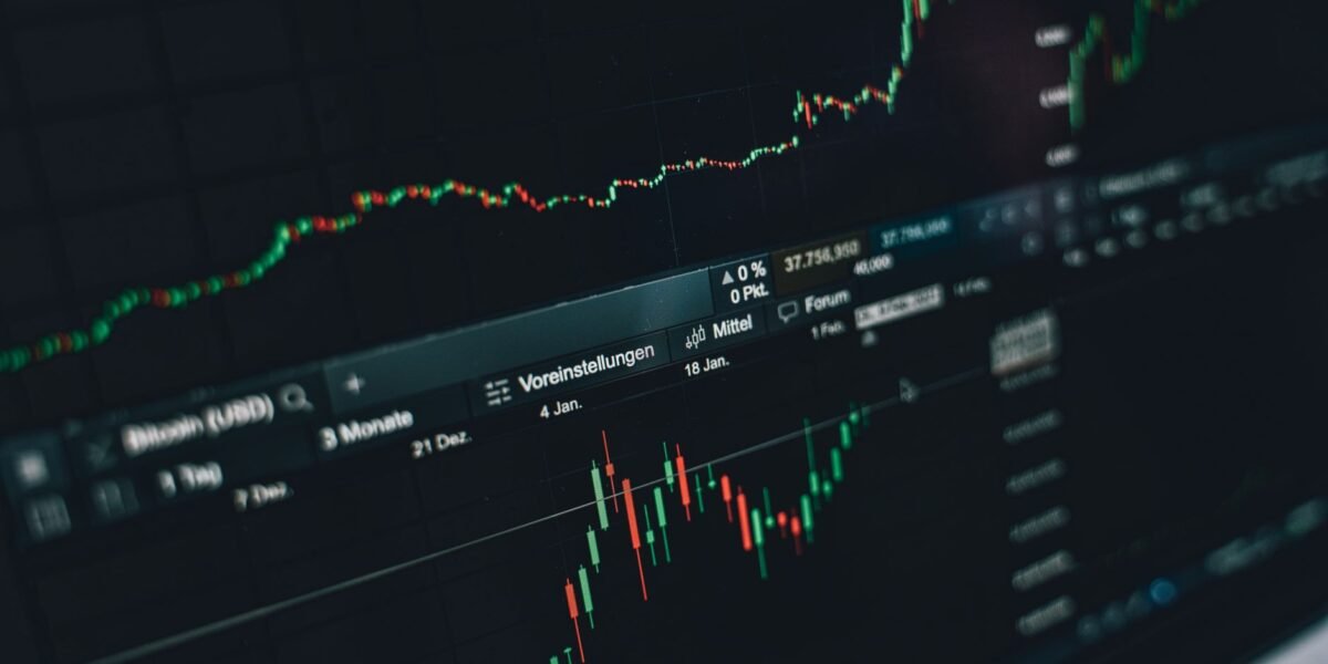 Close-up of a digital market analysis display showing Bitcoin and cryptocurrency price trends.